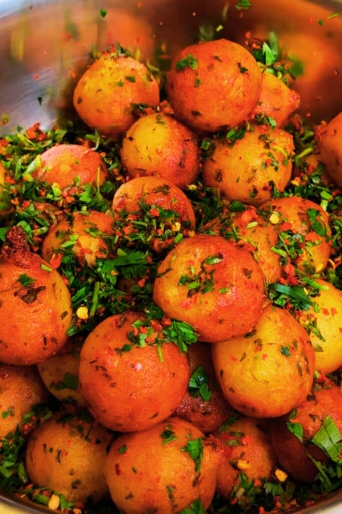Potatoes boiling in large pot of salted water